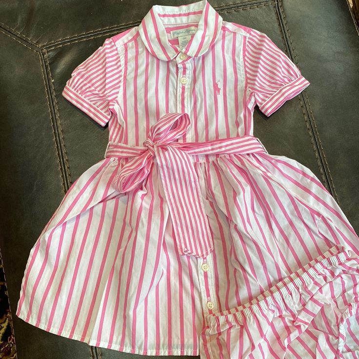 Ralph Lauren Pink And White Striped Polo Dress Size 12 Months Washed In Dreft, Never Worn Cute Ralph Lauren Dress For Spring, Ralph Lauren Daywear Dresses For Spring, Casual Cotton Ralph Lauren Dresses, Casual Cotton Dresses By Ralph Lauren, White Fitted Dress For Playwear, Preppy Pink Dress For Spring, Preppy Cotton Dress For Playtime, Cute Fitted Ralph Lauren Dress, Preppy Pink Summer Dress