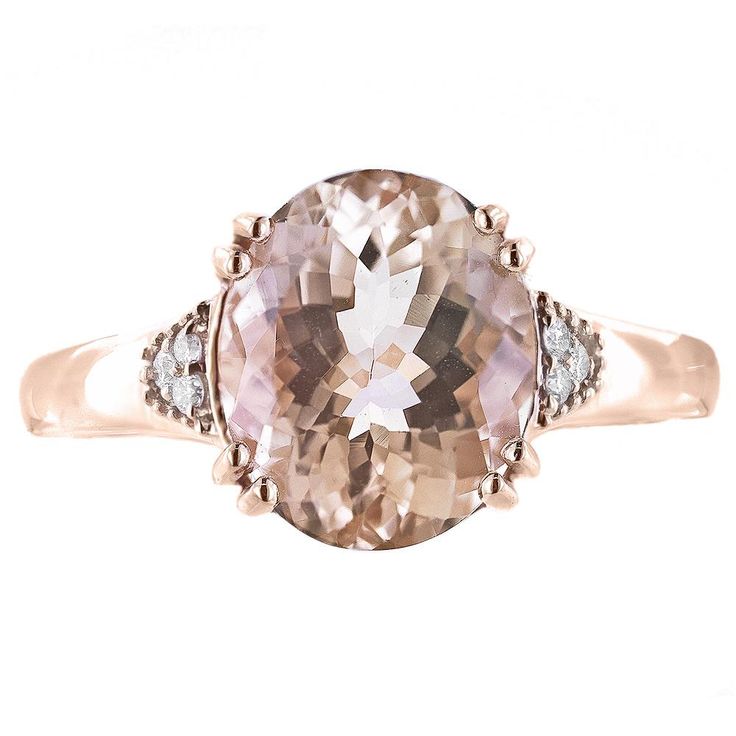 Everything’s coming up roses with this spectacular ring featuring a large, rosy, oval morganite set in rose gold. Diamond accents add an extra sparkle making this a truly eye-catching piece. Metal: 14K Rose Gold Gemstones: 11x9 mm Morganite, 3.0 ct.; Diamond, .06 cttw. Size: 7 Dimensions: 0.43"L x 0.38"W Rose Gold Topaz Ring With Morganite And Accent Stones, Rose Gold Rings With Diamond Accents And Morganite, Elegant Rose Gold Topaz Ring With Diamond Accents, Elegant Rose Gold Topaz Ring With Accent Stones, Formal Rose Gold Topaz Ring With Accent Stones, Rose Gold Oval Morganite Topaz Ring, Fine Jewelry Rose Gold Topaz Ring With Accent Stones, Rose Gold Topaz Ring With Accent Stones, Formal Rose Gold Topaz Ring With Diamond Accents