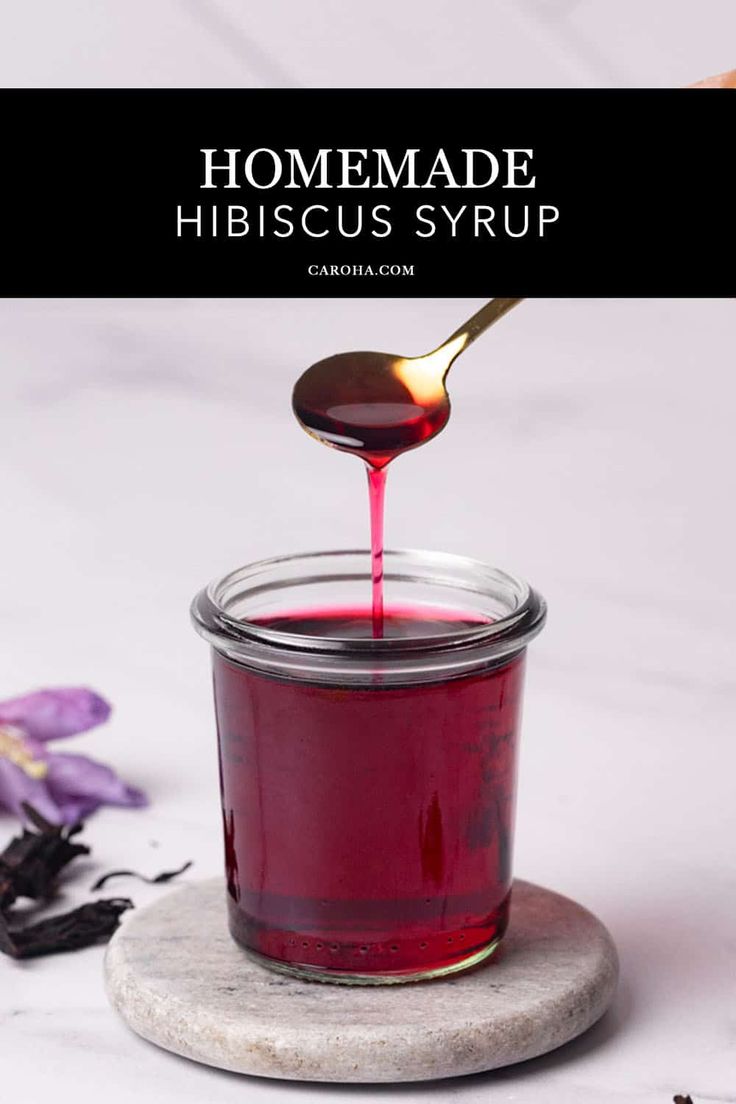 Hibiscus syrup in a glass jar being scooped. Hibiscus Simple Syrup Recipe, Hibiscus Recipe, Hibiscus Cocktail, Hibiscus Drink, Hibiscus Syrup, Natural Food Dye, Flower Desserts, Cocktails And Mocktails, Floral Dessert