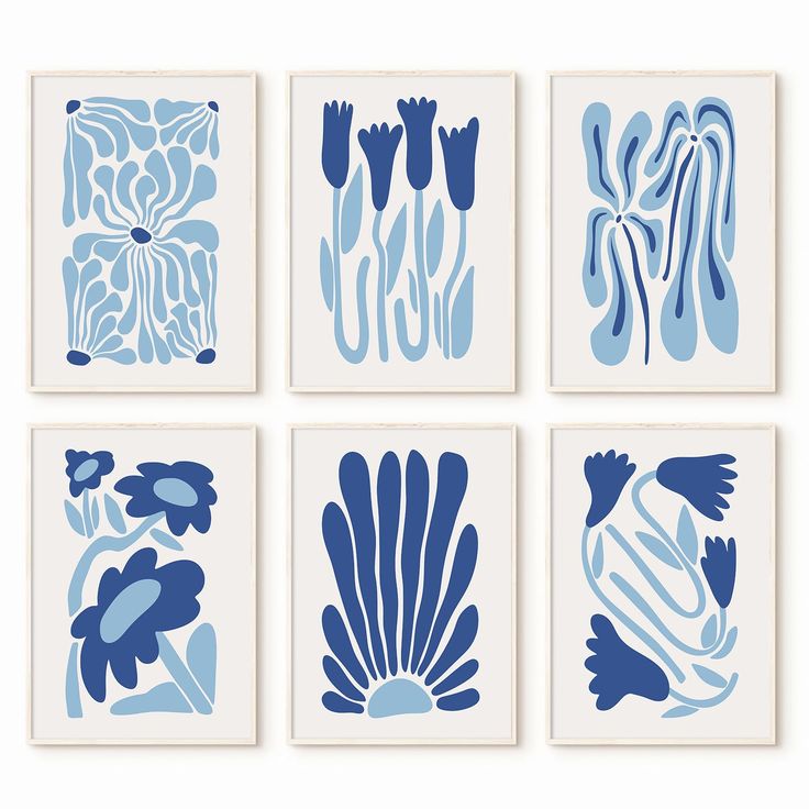 four blue and white art prints with different shapes