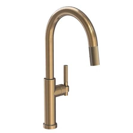 a brass colored faucet on a white background