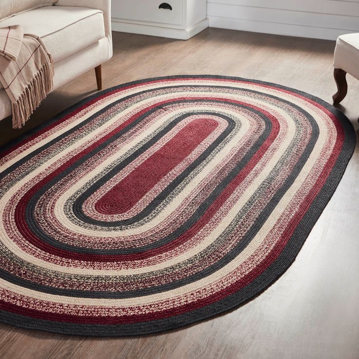 a red and black rug in a living room