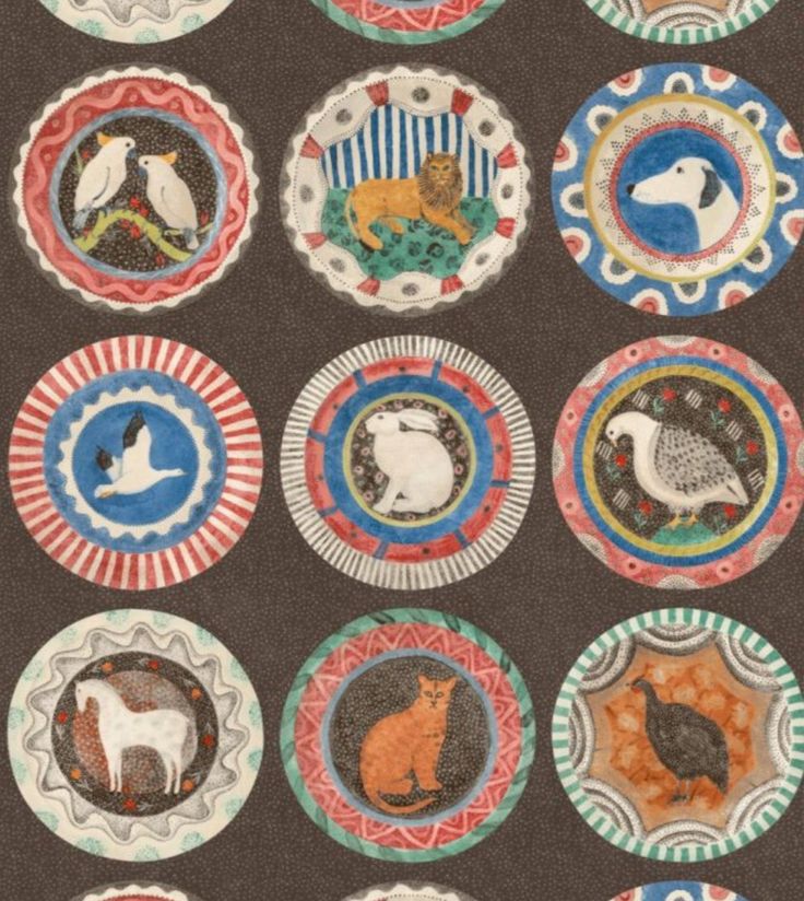 many different colored plates with animals on them