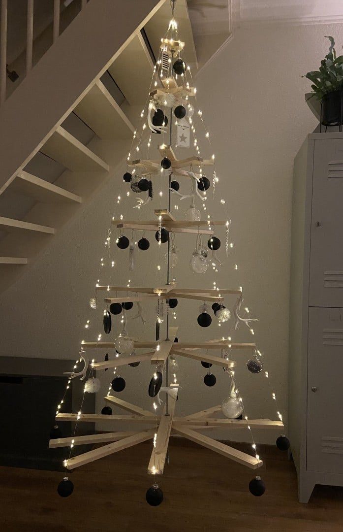 a white christmas tree with lights on it