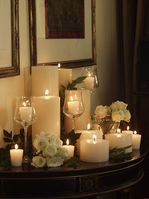 a table with candles and flowers on it