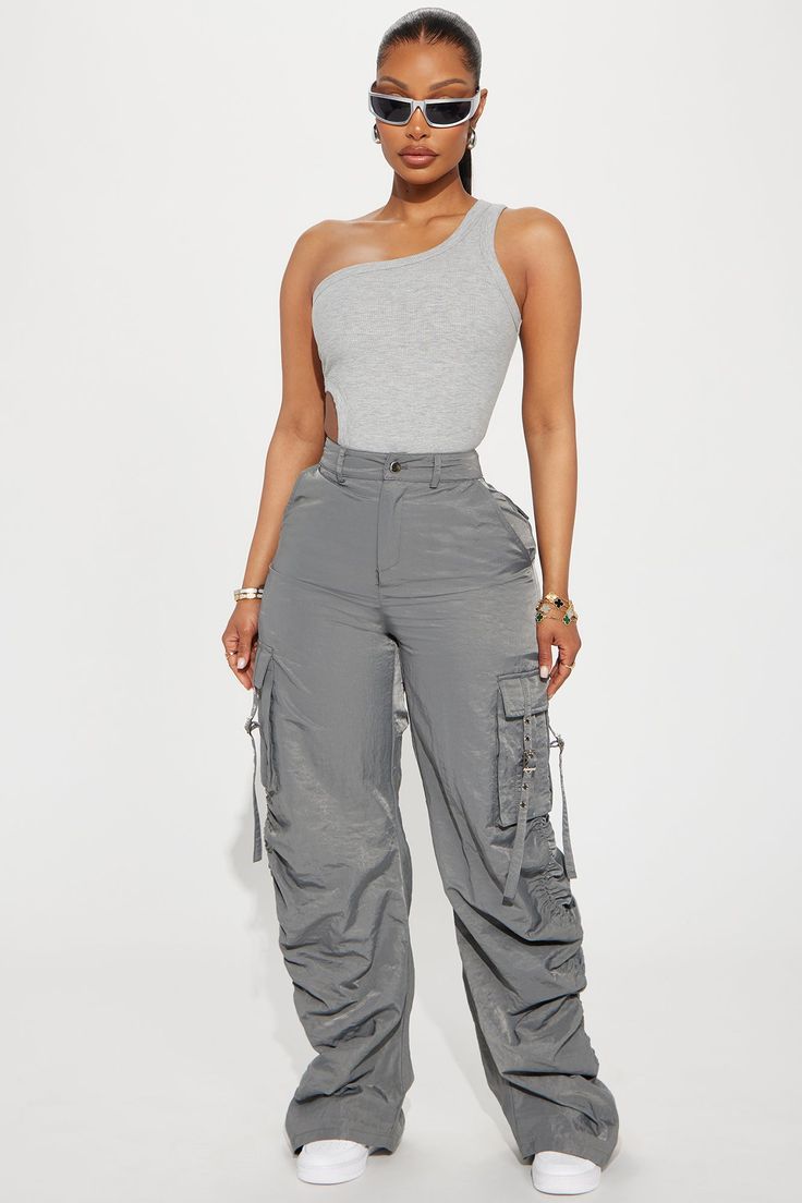 Available In Charcoal And Olive. Jogger Pant High Rise Button & Zip Closure Cargo Pockets Strap Detail Stacked Detail Toggles At Hem 100% Nylon Imported | Over It Stacked Cargo Jogger Pant in Charcoal size Medium by Fashion Nova Charcoal Joggers Outfit, High Rise Cargo Pants Outfit, Spring Outfits Street Style 2024, Cargo Pants Outfit Black Women, Cargo Joggers Outfits, Cargo Outfits Women, Cargo Outfits, Joggers Outfit Women, Jogger Outfit