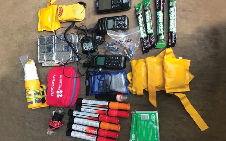 an assortment of emergency items laid out on the ground