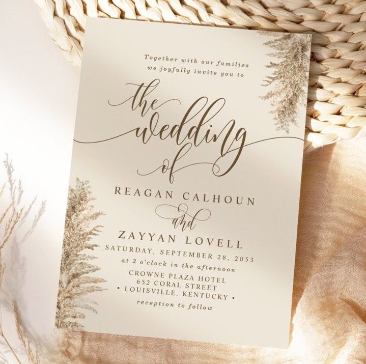 the wedding stationery is displayed on top of a basket