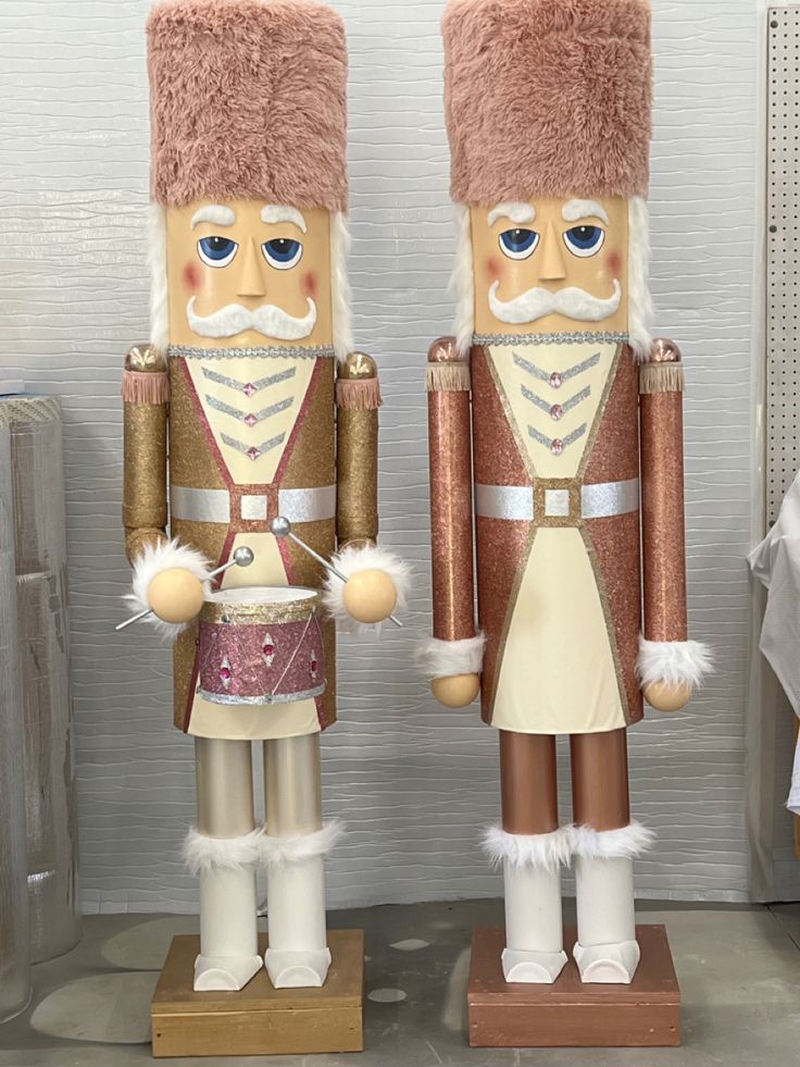 two nutcrackers are standing next to each other