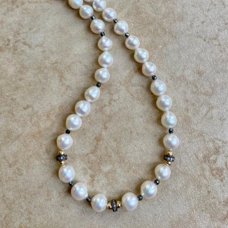 You'll love the timeless look of this beautiful Akoya pearl necklace with diamond spacer beads. Perfect for any occasion, these pearls boast an exquisite luster and quality, lasting for years to come. Add a touch of classic elegance to any ensemble with this gorgeous necklace. Length 18" Pearls are believed to offer protection, as well as attract good luck and wealth. They bring centering and a calming reflection, as well as attune the wearer to the ebb and flow of life. Solar Plexus/Sacral Chak Pearl Necklace With Diamond, Akoya Pearl Necklace, Necklace With Diamond, Ebb And Flow, Sacral Chakra, Solar Plexus, Akoya Pearls, Gorgeous Necklaces, Silver Diamonds