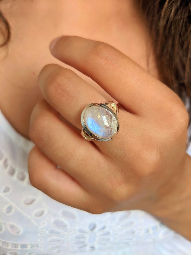 Introducing our Simple Chunky Sterling Silver Moonstone Ring, a timeless and versatile piece that effortlessly combines elegance and natural beauty. Crafted with meticulous attention to detail, this ring showcases a lustrous moonstone set in a chunky sterling silver band. The moonstone, known for its ethereal glow and captivating iridescence, is a stone of intuition, calmness, and feminine energy. Its mesmerizing play of light and colors adds a touch of enchantment to this ring, making it a trul Bohemian Moonstone Crystal Ring With Cabochon, Bohemian Moonstone Cabochon Crystal Ring, Bohemian Oval Cabochon Moonstone Ring, Bohemian Moonstone Cabochon Jewelry, Bohemian Cabochon Moonstone Ring Gift, Bohemian Moonstone Crystal Ring For Healing, Handmade Moonstone Ring For Healing, Handmade Bohemian Oval Moonstone Ring, Bohemian Moonstone Cabochon Ring