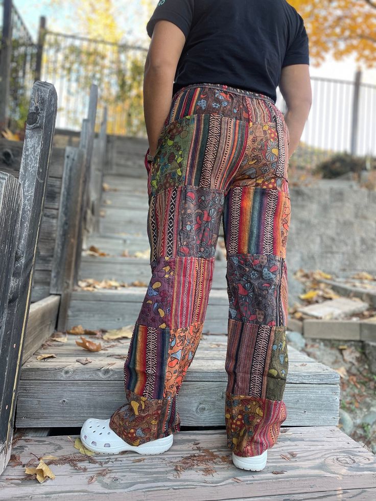 Colorful patchwork, durable fabric, and big pockets make these pants the perfect option...for any season! - Perfect as streetwear, loungewear, yoga, festivals, shopping, etc. - GREAT HOLIDAY GIFT FOR LOVED ONES OF ALL AGES!! - Thick, durable fabric - ADORABLE Mushroom Patches (zoom in for a better look!) - Cute and colorful patchwork design - Adjustable waist - Elastic cuff for put-together look AVAILABLE SIZES: S/M Waist: 26 inches - 44 inches Length: 39 inches L/XL Waist: 30 inches - 52 inches Cute Cargo Pants, Hippy Pants, Streetwear Loungewear, Patchwork Pants, Festival Pants, Hippie Pants, Bohemian Summer, Hippie Outfits, Pantalon Cargo