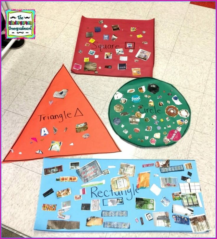 three triangle shaped bulletin boards sitting on top of a white floor next to each other