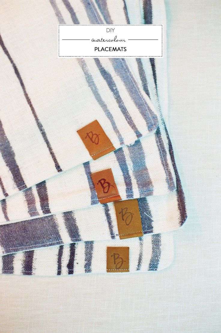 three pieces of cloth with brown and white designs on them