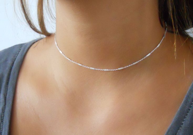 "Beautiful silver choker necklace. Perfect to wear on its own or to layer with more necklaces of your collection. ⊹ L e n g t h 13\" + 3\" Extender chain ⊹ D e t a i l s Sterling silver chain with tiny tubes Sterling silver spring clasp and links ⊹ Read about my shop Processing and Delivery times, Payment options, Packaging and Care instructions here: https://www.etsy.com/il-en/shop/annikabella#more-section" Collar Necklace Choker, Sterling Silver Layered Necklace, Silver Layered Necklace, Name Necklace Silver, Diamond Bar Necklace, Star Necklace Silver, Sterling Silver Choker, Necklaces Silver, Silver Necklace Set