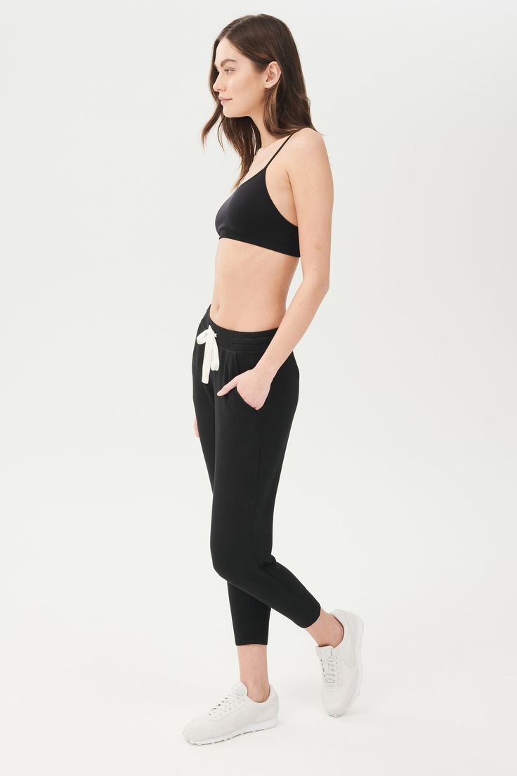 An easy to wear seamless bra designed to go from gym to everyday...seamlessly. Chafe-free fabric lets you move with easy and layers beautifully under any top. BEST FOR: running, yoga, crossfit, barre, pilates, spin class or gym workouts. Model is 5'10" and wears a size XS/S. Comfortable Seamless Black Activewear, Comfortable Black Seamless Activewear, Black Seamless Comfort Fit Activewear, Moisture-wicking Athleisure Activewear For Relaxation, Go-dry Athleisure Activewear For Relaxation, Sporty Seamless Sports Bra For Pilates, Supportive Activewear For Relaxation, Sporty Fitted Activewear For Relaxation, Fitted Athleisure Activewear For Relaxation