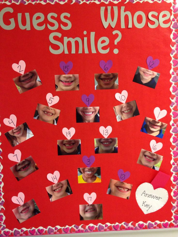 a bulletin board with pictures of people's faces and hearts on it that says guess whose smile?