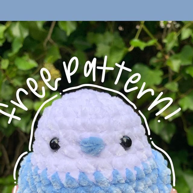 a crocheted blue and white bird with the words happy easter written on it