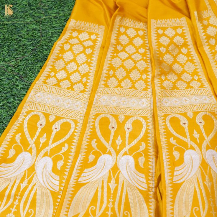 Step into the world of timeless elegance with our Shikargah Lehenga adorned with exquisite bird motifs. This masterpiece, crafted from Pure Katan Silk, pays homage to the rich heritage of Banarasi textiles. With its graceful kalis, a blouse piece, and a dupatta border adorned with intricate Meenakari and Cutwork, it promises to make you look ethereally beautiful on any special occasion. Lehenga With Blouse, Dupatta Border, Bird Motif, Katan Silk, Blouse Fabric, Cut Work, Blouse Piece, Pure Silk, Lehenga