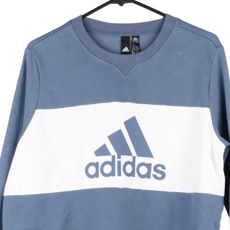 Description:Vintage Age 16 blue Adidas sweatshirt, fits x-large.GENDER: girls CONDITION: very good.STYLE: sweatshirtERA: 1990sCOLOUR: blueFABRIC: cotton blend Blue Adidas Sportswear Top With Logo, Blue Adidas Sportswear Top, 90s Crew Sweatshirt With Logo Print, Cotton Crew Sweatshirt With Three Stripes Branding, Adidas Logo Cotton Sweatshirt For Winter, Blue Adidas Logo Cotton Top, Blue Cotton Adidas Logo Tops, Winter Adidas Logo Cotton Sweatshirt, Blue Adidas Logo Tops For Streetwear