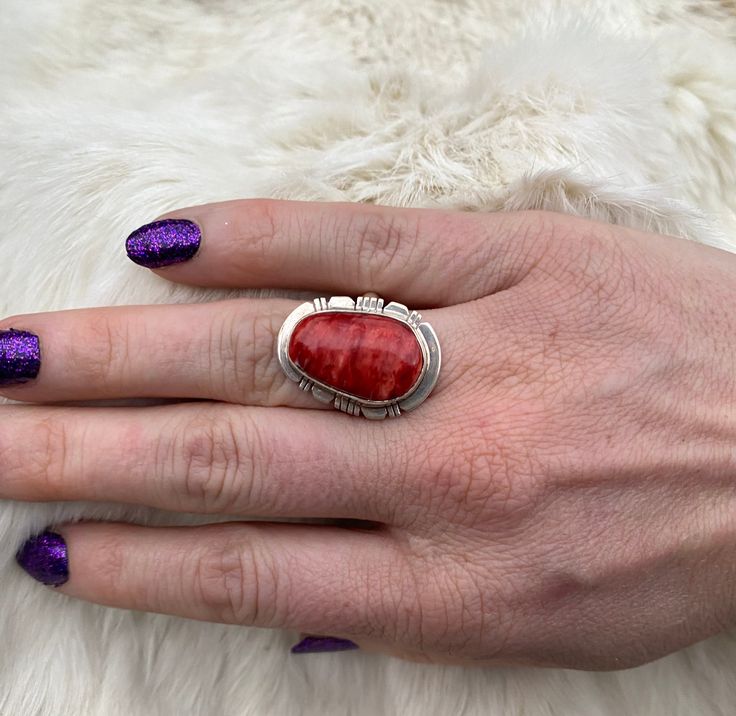 A gorgeous marble Red Spiney Ring set in beautiful Sterling Silver. Coral Cabochon Jewelry For Gift, Oval Coral Jewelry For Gift, Coral Oval Jewelry For Gifts, Red Untreated Rings As A Gift, Red Oval Natural Stone Jewelry, Red Oval Rings With Natural Stones, Red Oval Jewelry With Natural Stones, Untreated Red Rings As A Gift, Artisan Red Oval Jewelry