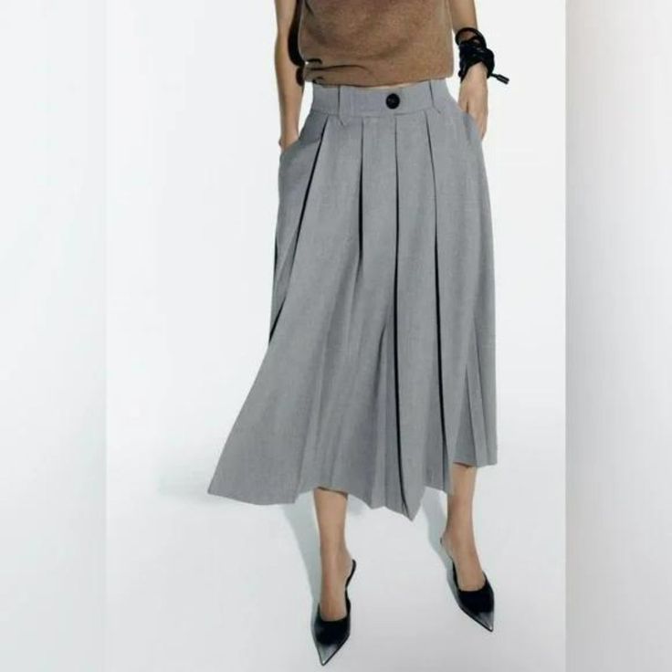 Midi Skirt With Pleats At Waist. Flared Legs. Back Zip Closure. Gray High Waist Gray Pleated Skirt, Casual Long Gray Skirt, Casual Gray Long Skirt, Gray High Waist Skirt For Spring, Gray High Waist Skirt For Work, Casual Gray Pleated Skirt, Casual High Waist Pleated Skirt For Office, Gray High Waist Pleated Skirt For Spring, Office Long Skirt With Pockets