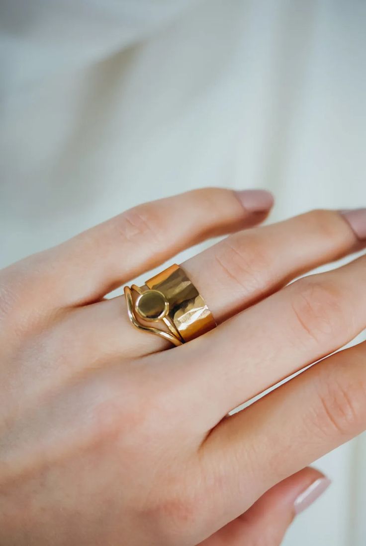 A large gold pebble sits on top of a delicate gold stacking ring. The band measures approximately 1mm in width. This ring is made entirely out of SOLID 14K GOLD metal. We make each 14K Gold pebble by hand so that each ring will look slightly unique — just like pebbles found in nature. We lightly hammered the band for a bright, reflective shine. Every piece is organic and unique — no two Hannah Naomi pieces are exactly alike.Hand-crafted to order in our Portland, OR studio. Arch Ring, Low Key Wedding, Pebble Ring, Ring Stacks, Minimalist Beauty, Teardrop Ring, Ring Shapes, Gold Ring Stack, Organic Design