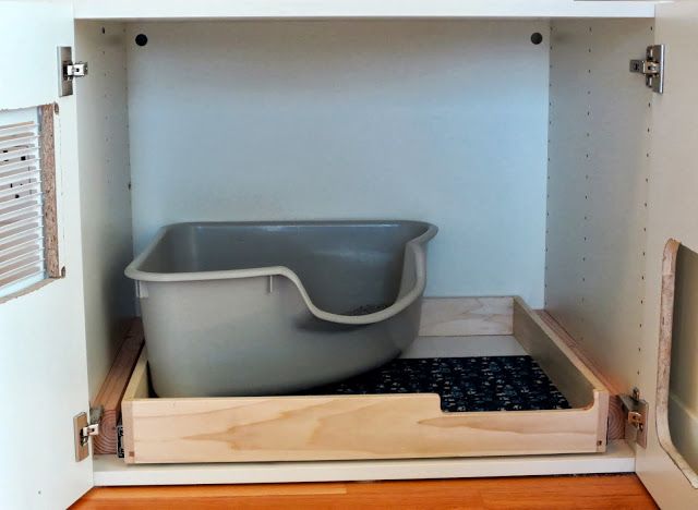 an empty bathtub in a cabinet with the door open