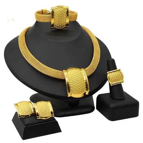 Indulge in luxury with this exquisite Dubai Gold Necklace Set, perfect for wedding parties. With its opulent design and superior craftsmanship, this set features a necklace, bracelet, earrings, and ring. Make a lasting impression and elevate your style with this luxurious jewelry set.'