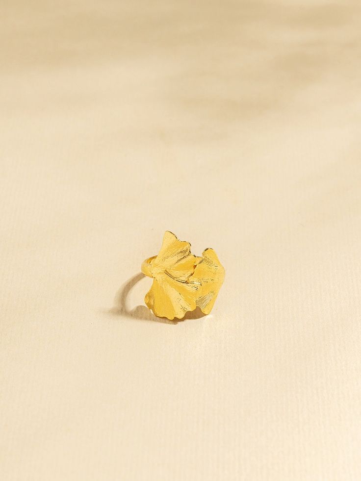 "Ginko ring - this is a large gold statement leaf ring. This gold nature-inspired botanic petal ring is a unique gold jewelry piece that will make an outstanding nature lover gift. This organic petal-shaped ring is large and impressive. It is designed as organic wild petals that are natural, and light, and wrap beautifully around your finger. The statement leaf ring has a gorgeous texture and movement that plays beautifully with light. The leaf is an expression of living harmoniously with the in Nature-inspired Yellow Gold Flower Ring For Gift, Nature-inspired Yellow Gold Flower Ring As Gift, Nature-inspired Yellow Gold Flower Ring Gift, Nature-inspired Yellow Gold Flower Ring, Gold Flower Ring Nature-inspired, Gold Flower-shaped Nature-inspired Rings, Gold Nature-inspired Flower Ring, Nature-inspired Gold Flower Ring, Nature-inspired Gold Flower Ring For Anniversary