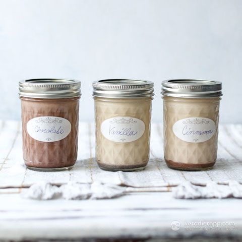 three jars with labels on them sitting on a table