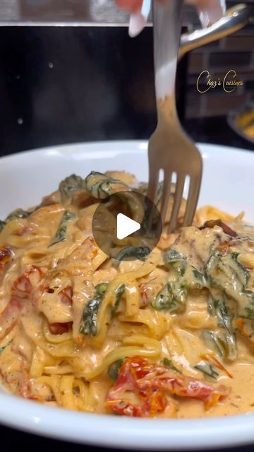 a fork is stuck into a pasta dish