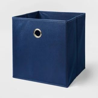 a blue storage bin with a metal ring on the top and bottom, in front of a white background