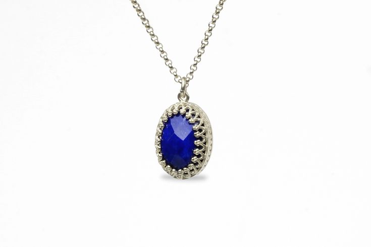 Effortlessly chic and intricate, this blue stone necklace gorgeously showcases a Lapis Lazuli stone, oval-cut and held in a delicately detailed setting. Lapis Lazuli is a September birthstone and will be a lovely touch of sophistication for everyday and special occasions. A stylish and vibrant jewelry piece for you or for a gift Finish is customizable to other materials Can be purchased in different necklace lengths Nickel Free and Tarnish Resistant Thoughtfully packaged with a fancy gift kit Pr Elegant Lapis Lazuli Gemstone Necklace, Elegant Lapis Lazuli Faceted Necklace, Elegant Faceted Sapphire Necklaces, Elegant Sapphire Faceted Necklace, Elegant Faceted Sapphire Necklace, Elegant Blue Faceted Necklaces, Elegant Blue Faceted Necklace, Elegant Oval Faceted Necklaces, Elegant Oval Cabochon Lapis Lazuli Jewelry