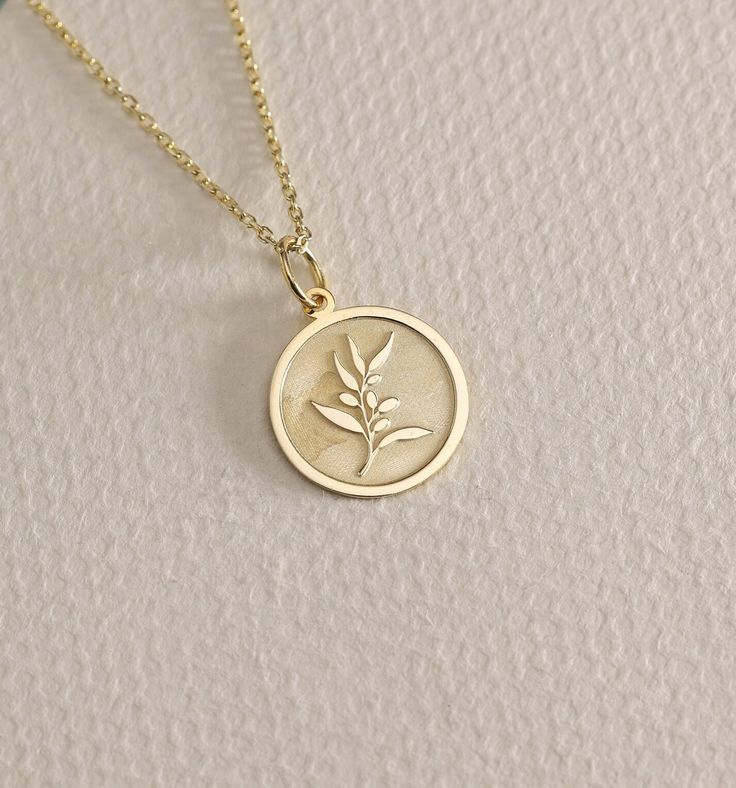 14K Real Solid Gold Olive Branch gold necklace ● Material of pendant: Solid Gold 14k ( REAL GOLD ) ● Metal Stamp: 14L ( REAL GOLD ) ● The pendant is available in 6 sizes: - 14,0 mm / 0,55 inches ( Diameter ) In the photos - 15,3 mm / 0.60 inches ( Diameter ) - 16,5 mm / 0,65 inches ( Diameter ) - 19,1 mm / 0,75 inches ( Diameter ) - 21 mm / 0,82 inches ( Diameter ) - 23 mm / 0.90 inches ( Diameter ) ( In the photos the size is 14mm / 0.55 inches Diameter ) ( Jump Ring inner diameter: 4 mm ) ● Ma Olive Branch Necklace, Delicate Engraved 14k Gold-filled Necklaces, Delicate Engraved 14k Gold Filled Necklaces, Delicate 14k Gold Filled Engraved Necklaces, Dainty Yellow Gold Medallion Jewelry, Recycled Gold Rose Gold Pendant Jewelry, Delicate Tarnish Resistant Medallion Jewelry, Delicate Polished Gold Jewelry, Rose Gold Recycled Gold Pendant Jewelry