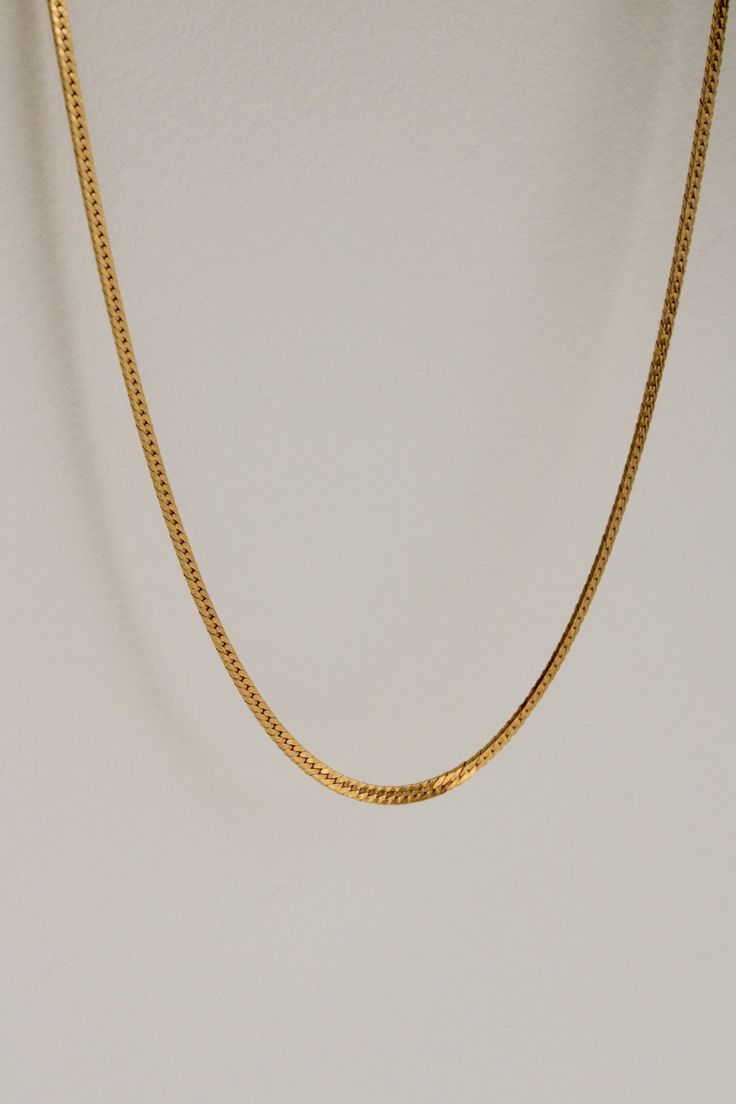 The herringbone chain style is an intricate tapestry of links, laid parallel to each other. It is a classic chain style tracing its origins to Ancient Egypt, and is named for its resemblance to the many slanted bones of the herring fish. The chain lies flat against the skin, gracefully contouring the wearer's neck. The herringbone structure originates from a bricklaying legacy of Ancient Rome and medieval times known as opus spicatum. The pattern was often used in architecture and walkways, as t Classic Gold Herringbone Necklace With Snake Chain, Minimalist Herringbone Necklace For Formal Occasions, Formal Minimalist Herringbone Chain Necklace, Classic Herringbone Link Necklace, Herring Fish, Herringbone Chain Necklace, Herringbone Chain, Herringbone Necklace, Medieval Times