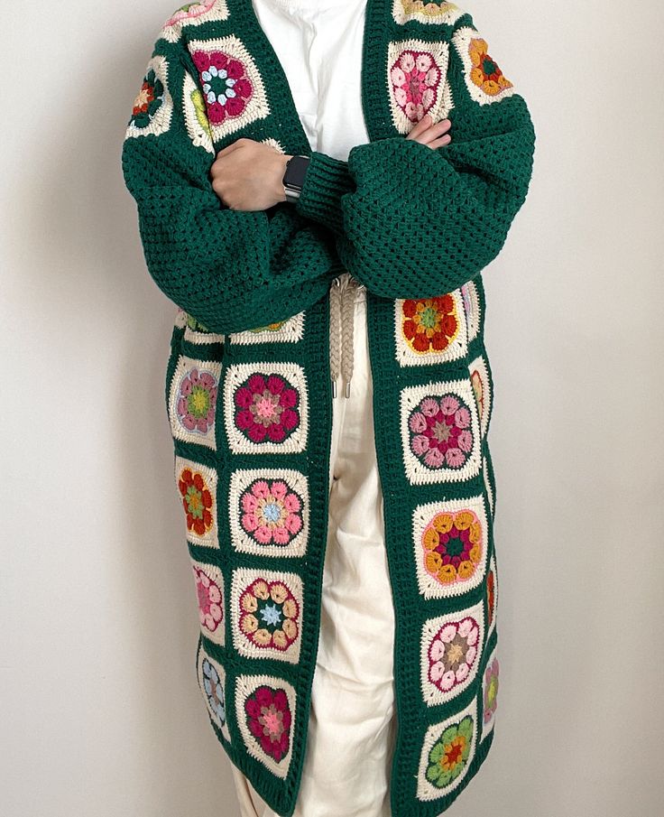 * African flower long cardigan in petrol blue joining color will serve you a unique outfit for summer nights, autumn and winter. * High quality cotton yarn is light weighted and suitable for all seasons' use. * Boho afghan long jacket will be a great match with crops and shorts, jeans and t-shirts. * A great festival jacket with vibrant and eye catching colors. * Chic hippie style long coat with baloon sleeve. * It has a shaggy design, does not wrap your body tight. * It fits for S, M and L women's letters. It will have a comfort oversized look on S size women, fits well and feels comfy for M size women, fits well for L size women too if your waist&hip are not larger than 48 inches (122 cm). * The measurements: The width (bust, hip, waist):  48 inches = 122 cm The length: 38.5 inches = 98 Casual Long Patchwork Cardigan, Cozy Patchwork Cardigan For Spring, Cozy Spring Patchwork Cardigan, Bohemian Knitted Cotton Outerwear, Vintage Granny Square Outerwear For Spring, Long Green Cotton Outerwear, Long Patchwork Cardigan For Fall, Handmade Trendy Outerwear For Spring, Trendy Handmade Spring Outerwear