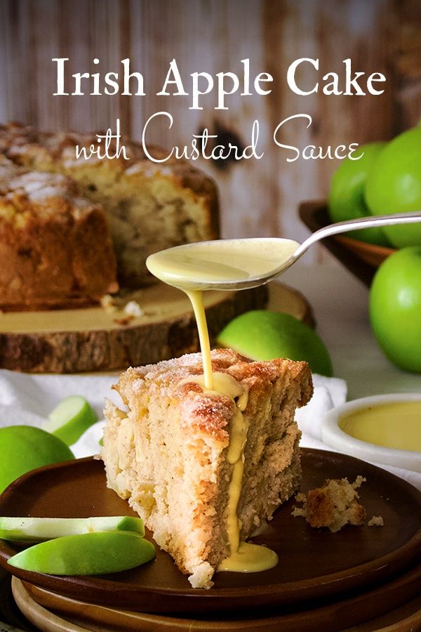 a slice of irish apple cake with custard sauce being poured onto it on a plate