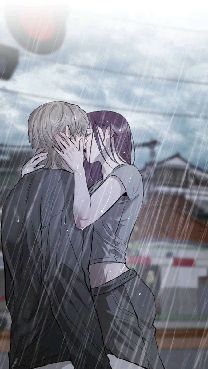 two people are kissing in the rain with their faces close to each other and one person is