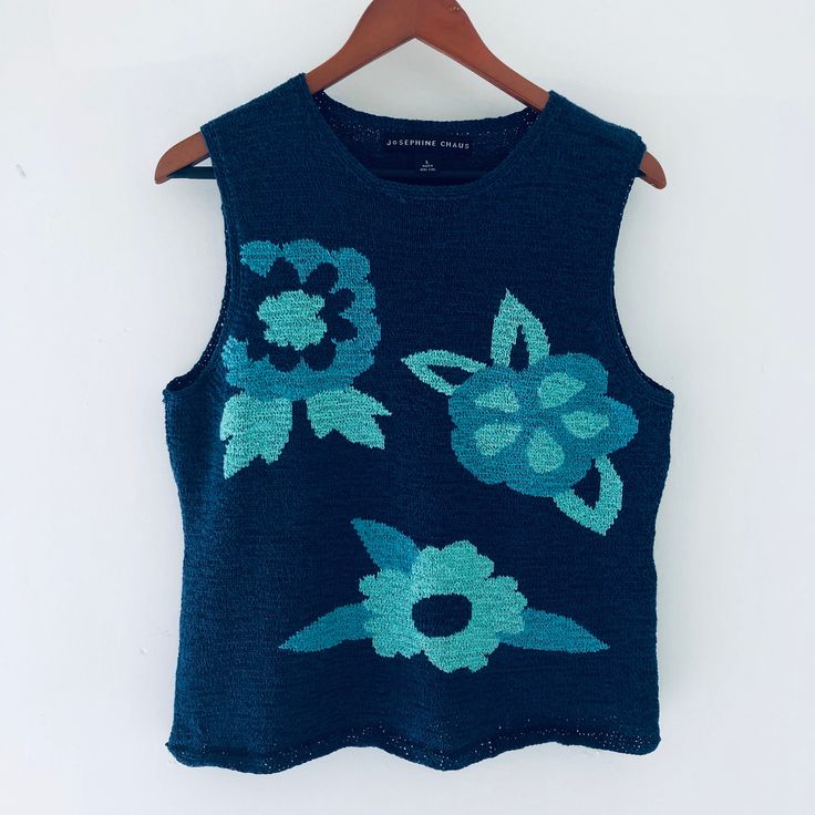 "Beautiful blue and turquoise floral knitted top from the 90's made for \"Josephine chaus\" in Hong Hong, this is great for spring, cool summer and fall with blouse or without, excellent condition, large size armpit to armpit 20\" W X 22\" Tall from the shoulder, please email us with your questions, thank you for looking." Blue Fitted Tank Vest, Blue Tank Vest For Summer, Fitted Blue Tank Vest, Blue Fitted Vest Top, Fitted Blue Vest For Summer, Blue Cotton Sleeveless Sweater Vest, Blue Knit Vest For Spring, Blue Knit Sleeveless Vest, Blue Cotton Crew Neck Sweater Vest