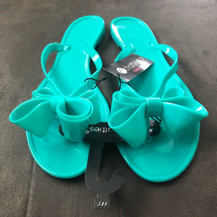 Brand New Teal Bow Sandals Size 7/8 Turquoise Synthetic Sandals For Spring, Blue Synthetic Jelly Sandals For Summer, Blue Jelly Sandals For Summer Beach, Blue Jelly Sandals For Beach And Summer, Blue Flat Jelly Sandals For Summer, Turquoise Open Toe Flip Flops For Spring, Trendy Blue Flip Flops For Spring, Turquoise Flip Flops For Beach In Spring, Spring Turquoise Open Toe Flip Flops