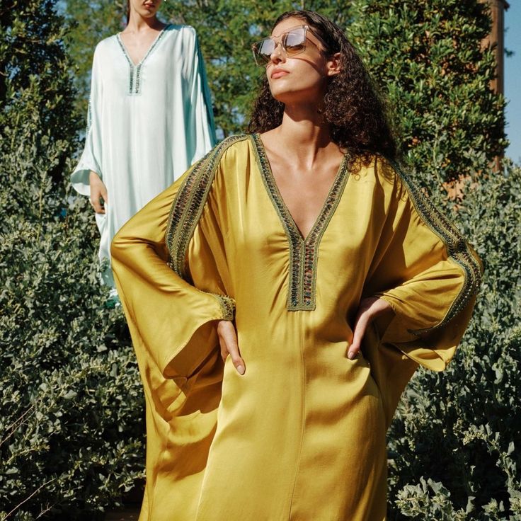 Reach For This To Channel Old School Glam While Keeping It Light And Easy For Your Resort Edit. This Classic, Silky Organic Caftan Shape Features Luxe Hand Beaded Detail Along The Sleeve And At V-Neck. Loose-Fitting With Slits On The Side, It Radiates A Luxurious, Elegant Summertime Vibe. Stun In The Sun From St Barths To Biarritz In This Delight. 60% Vis(Flos) 40% Vis One Size $525 Vacation Embellished Tunic Kaftan, Beach Long Sleeve Embellished Kaftan, Embellished Tunic Kaftan For Vacation, Long Sleeve Embellished Kaftan For Beach, Embellished Long Sleeve Kaftan For The Beach, Embellished V-neck Kaftan For The Beach, Beaded Dresses For Vacation, Spring Vacation Embellished Kaftan, Spring Embellished Kaftan For Vacation