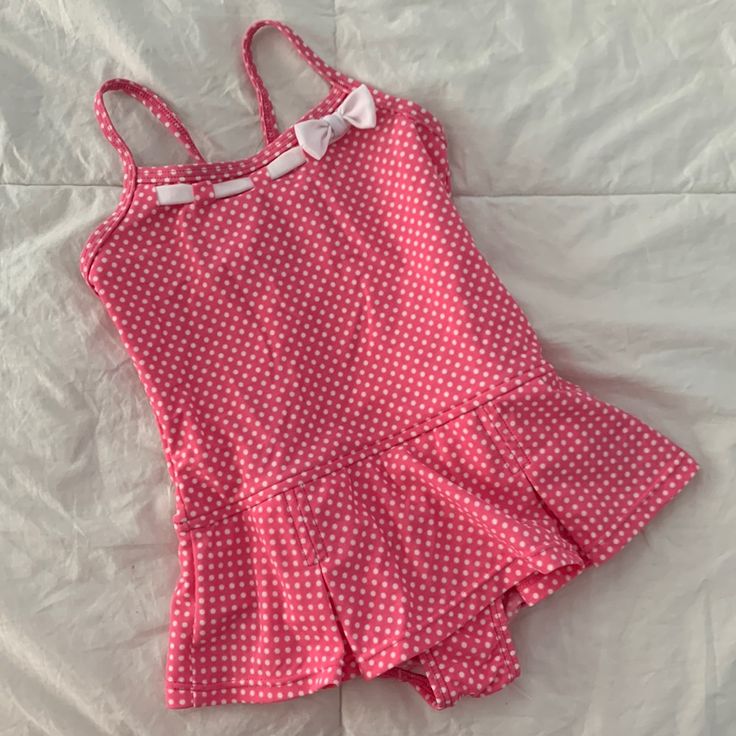 Lands’ End Skirted One-Piece Swimsuit. Pink With White Polka Dots & Ribbon Detail At Neckline. Adjustable Cross-Back Spaghetti Straps. Attached Pleated Style Skirt. Nylon/Spandex Blend. Never Worn. Nwot Skirt Bathing Suit Two Piece, Cute Fitted Ruffle Swimwear, Cute Fitted Ruffled Swimwear, Fitted Summer Swimwear For Playtime, Fitted Swimwear For Summer Playtime, Pink Cotton Swimwear For The Pool, Fitted White Swimwear For Playtime, Fitted Cotton Playful Swimwear, Playful Fitted Cotton Swimwear