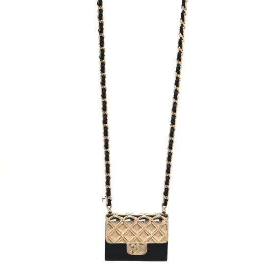 This is an authentic CHANEL Metal Resin Lambskin Flap Bag Long Necklace in Gold and Black. This necklace features a leather threaded gold chain, and a flap bag shaped pendant with a gold quilted flap detail, black resin body, and Chanel CC logo. Gold Rectangular Wallet On Chain With Gold-tone Hardware, Luxury Rectangular Jewelry With Gold-tone Hardware, Elegant Black Jewelry With Gold-tone Hardware, Elegant Black Bag With Logo Charm, Elegant Gold Bag With Logo Charm, Luxury Everyday Jewelry With Logo Charm, Luxury Black Jewelry With Gold-tone Hardware, Designer Gold Bag With Logo Charm, Elegant Evening Bag With Logo Charm