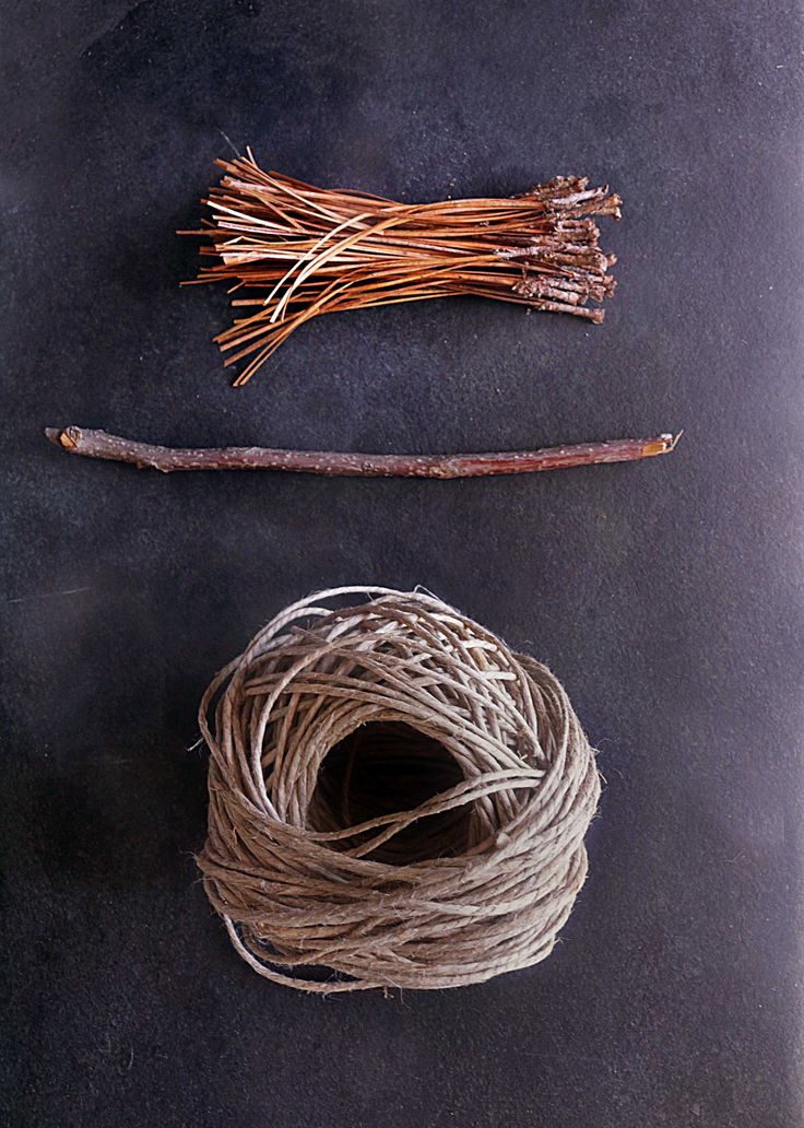 two bundles of twine next to each other on top of a black countertop