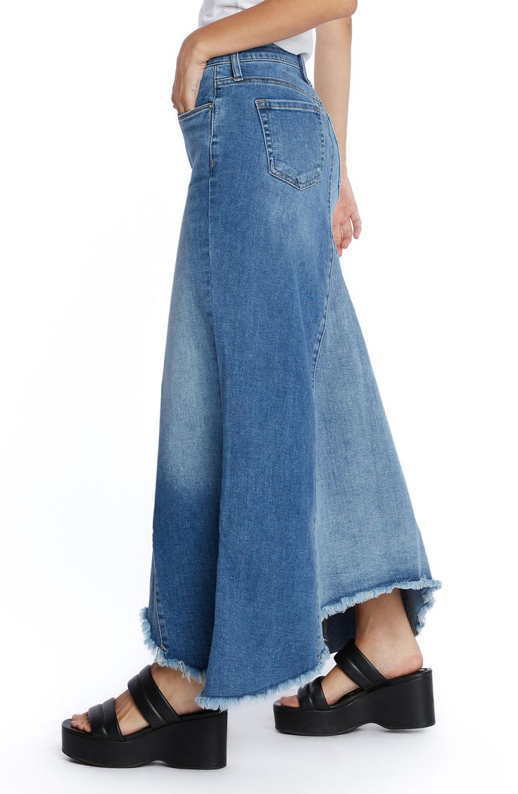 This updated jean skirt is designed in a pieced longline silhouette with a feathery fringed hem. 30" to 37" center front length (size 29) Unlined 91% cotton, 7% polyester, 2% spandex Machine wash, tumble dry Imported Asymmetrical Cotton Denim Skirt, Asymmetrical Hem Denim Skirt In Medium Wash, Medium Wash Denim Skirt With Asymmetrical Hem, Denim Bottoms With Medium Wash And Asymmetrical Hem, Fitted Medium Wash Denim Skirt With Asymmetrical Hem, Spring Medium Wash Denim Skirt With Asymmetrical Hem, Fitted Denim Skirt With Asymmetrical Hem In Medium Wash, Dark Wash Bottoms With Asymmetrical Hem For Summer, Asymmetrical Denim Skirt With Frayed Hem For Summer