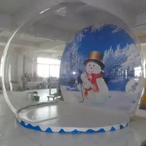 an inflatable snow globe with a snowman on it