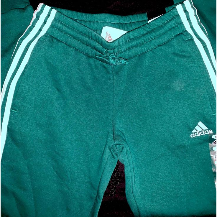 Condition: Brand New With Tags Size: Womens Small Adidas Collegiate Green/White Stripe Joggers Reg Price: $50 Send Your Best Offer No Exchanges/Returns/ Refunds Or Trades Bundle With Other Items From My Closet For An Offer! Smoke Free Home Green Bottoms For Jogging In Spring, Casual Joggers With Three Stripes Branding For Loungewear, Green Bottoms For Spring Jogging, Casual Three Stripes Joggers For Loungewear, Cotton Three Stripes Joggers For Spring, Spring Cotton Sweatpants With Three Stripes, Spring Cotton Joggers With Three Stripes, Casual Three Stripes Joggers For Spring, Casual Adidas Joggers For Spring