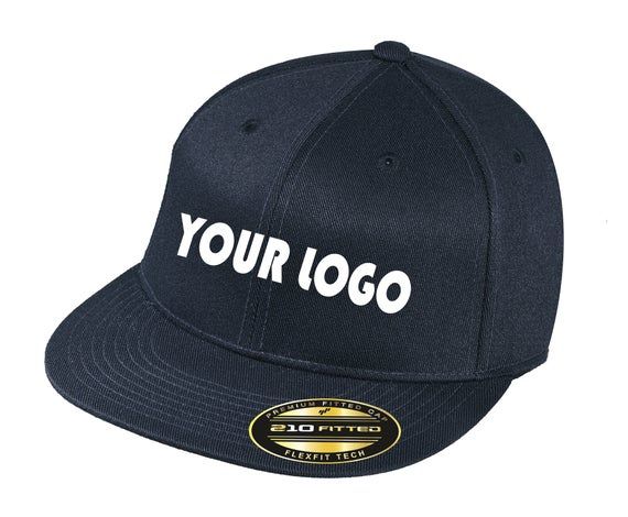 Custom Embroidery on Flexfit 210 Flat Bill CapSend us your logo, text, or monogram and we'll embroider it for you.Embroidery Size:Front: 4in W x 2in HBack: 3in W x 1in HThis cap is the best of both worlds, Snapback style flat bill cap with a Flexfit band.The patented Flexfit poly-weave spandex ensures you get a superbly comfortable fit, while the flat bill keeps you looking up-to-date.Fabric: 98/2 acrylic/spandex (White), 83/15/2 acrylic/wool/spandex (Colors)Structure: StructuredProfile: HighClo Classic Fitted Baseball Cap With Flat Bill, Fitted Flat Bill Trucker Hat For Sports, Fitted Baseball Cap With Embroidered Logo, Embroidered Flat Bill Fitted Hat, Fitted Snapback Baseball Cap With Embroidered Logo, Custom Logo Flat Bill Snapback Hat For Sports Events, Custom Logo Snapback Hat For Sports Events, Custom Logo Flat Bill Snapback For Sports Events, Customizable Flat Bill Snapback For Sports