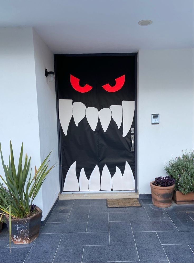 a door decorated to look like a monster with red eyes